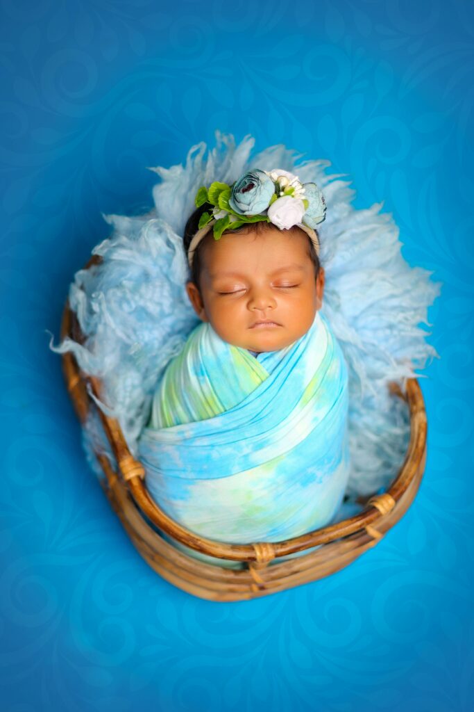Newborn photography swaddled pose